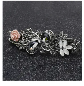 Exquisite vintage rhinestone spring hair clip detail with floral ornaments and sparkling gems.