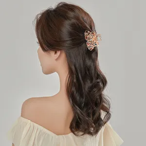 Crystal flower hair claw clip for women, sparkling rhinestone mini side hair accessory.