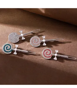 Rhinestone lollipop hair clips detail shot, sparkling crystal hairpins for sweet hairstyles.