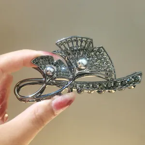 Elegant fan-shaped rhinestone hair claw clip, luxury metallic crystal pearl hair accessory for women.