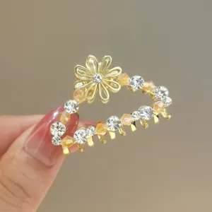 Gold rhinestone flower hair claw clip, elegant crystal hair accessory for women daily style.