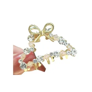 Elegant rhinestone bow hair claw clip, sparkling crystal metal hairpin for women hairstyles.