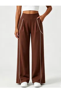 Brown wide leg casual pants detail view featuring white contrast piping and high waist fit.