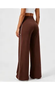 Women's brown high-waisted wide-leg yoga fitness pants featuring stylish white side piping details.