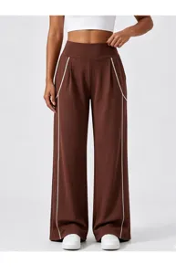 Brown high waist wide leg pants detail with contrast white piping, casual athleisure style.