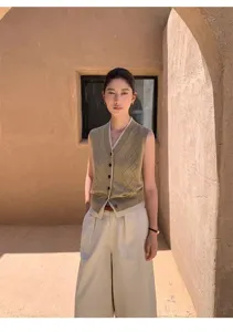 Women's V-neck contrast trim argyle hollow knit vest cardigan top for casual daily wear.