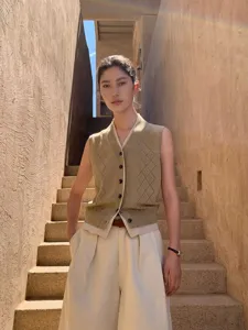 Women's chic V-neck argyle hollow-out knit vest, stylish sleeveless pullover sweater top.