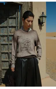 Gradient knit sweater for women, cozy crewneck pullover with artistic architectural graphic design.