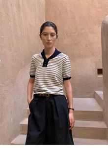 Striped short sleeve knit top detail, contrast collar and cuffs design, casual autumn style.