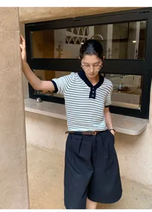 Chic women short sleeve striped knit polo top paired with casual bottoms for daily fashion wear.