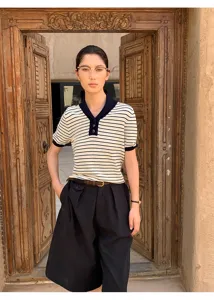 Detailed view of women striped short-sleeve knit polo top, vintage casual daily wear.