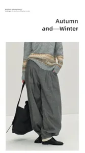 Wool blend pleated harem trousers detail shot, high waist styling with minimalist knitwear.