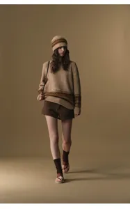 Detailed view of women's autumn winter high waist wool tweed shorts, stylish fashion outfit.