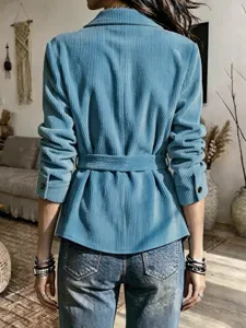 Blue corduroy blazer jacket with belt and lapel collar for women detail view shot.