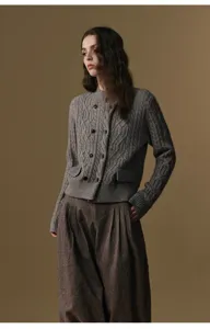 Wool blend high waist pleated harem trousers detail shot, stylish autumn winter women apparel.