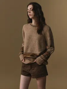 Women's retro brown knit sweater and high-waisted tweed shorts set for autumn winter style.