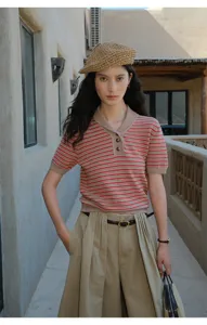 Women's contrast striped short-sleeve knit top, stylish casual early autumn apparel detail.