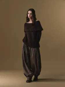 Women's wool blend high-waisted pleated harem pants, stylish autumn winter fashion trousers.