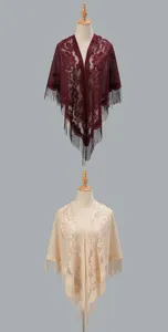 Detail view of breathable lace hollow triangular shawl women fringe fashion scarf cape outerwear.