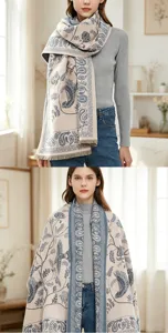 Close-up detail showing the exquisite vintage paisley and bird print pattern on the warm shawl.