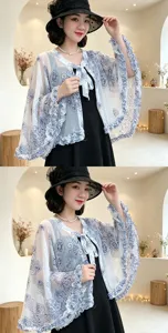 Detail view of a lightweight summer floral printed sun protection shawl with ruffles.