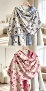 Close-up detail of double-sided floral imitation cashmere scarf, elegant floral pattern and fringe.