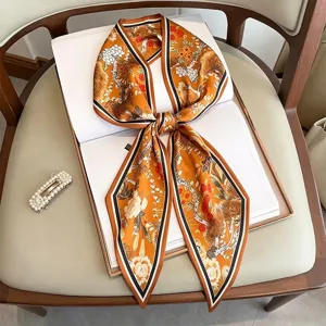 Versatile skinny silk scarf with elegant floral botanical print and chic border stripes for women.