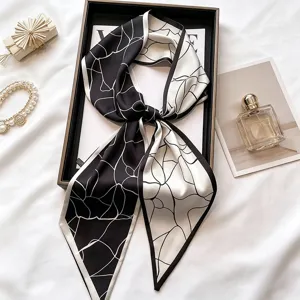 Chic black and white skinny silk scarf, elegant twilly neck and stylish hair accessory.