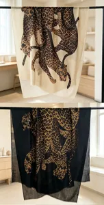 Detailed view of a vintage leopard print scarf, elegant long shawl hanging design.