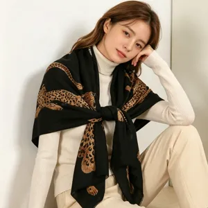 Stylish black leopard print scarf for women, cozy winter fashion shawl and warm neck wrap.