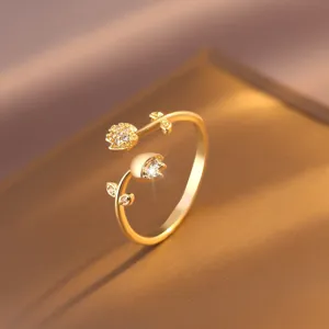 Exquisite gold-plated flower ring detail, featuring sparkling cubic zirconia and chic design.