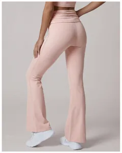 Detail view of high waist folded flare yoga pants in pink, showing back fit and silhouette.