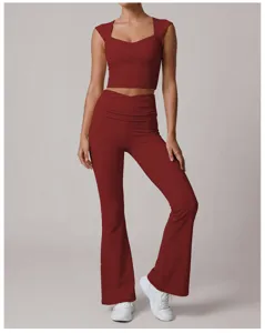 Women crossover waist cropped top and flared yoga pants set for fitness, pilates, and dance.