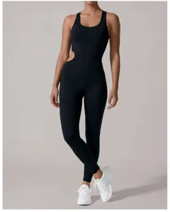Sleek black athletic jumpsuit for women, featuring a chic cut-out side and high stretch comfort.
