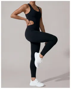Close-up detail view of a black sleeveless athletic jumpsuit featuring stylish side cutouts.