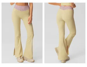 Women high waist flare yoga pants featuring polka dot waistband and side slit design.