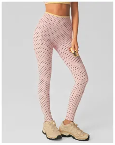 Dames roze gestipte hoge taille yoga legging, gedetailleerd overzicht van de fitness sportbroek.