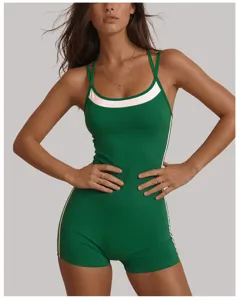 Green athletic yoga jumpsuit with contrast white trim, backless halter fitness romper.
