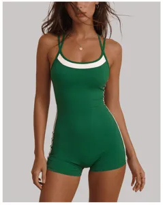 Detail shot of a green halter backless yoga jumpsuit with stylish white contrast piping trim.
