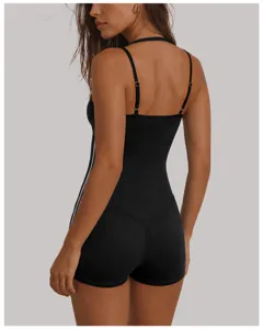 Back view of black halter yoga romper with side contrast stripes, slim fit athletic jumpsuit.