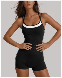 Sleek black athletic yoga jumpsuit with white contrast trim, perfect for gym workouts and active lifestyle.