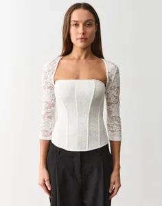 White lace floral square neck long sleeve top detailed view showing intricate fabric texture.