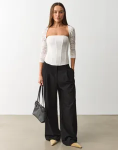 Women lace long sleeve corset top and black trousers set for stylish daily casual wear.