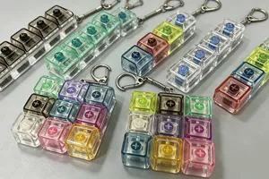 Detailed view of colourful luminous mechanical switch keychains, perfect for stress relief.