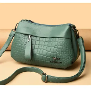 Green leather shoulder bag with crocodile pattern, stylish crossbody bag for women daily use.