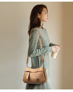 Women's PU leather shoulder bag casual crossbody bag with crocodile texture and adjustable strap.
