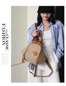 Stylish women canvas backpack with top handle and tassel detail, casual daily travel shoulder bag.
