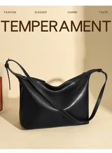 Vintage black leather underarm shoulder bag for women, casual hobo tote bag for daily commute.