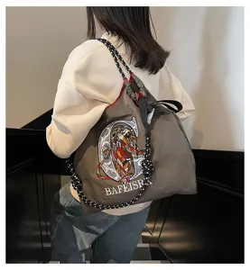 Large capacity embroidered canvas tote bag crossbody shoulder bag for women daily commuting.