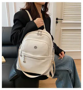 Detail view of a white fashion women backpack, large capacity casual travel bag, lightweight.